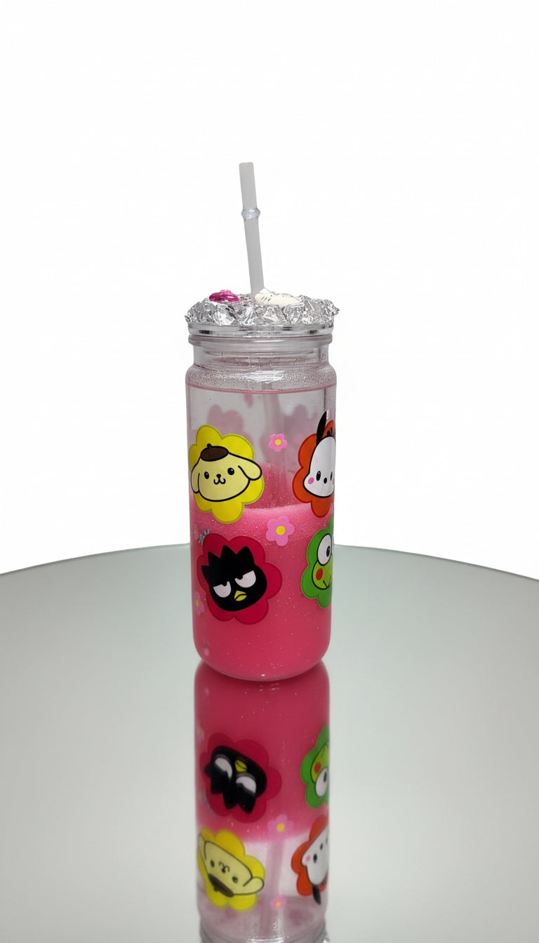Pink tumbler with cartoon characters and a straw on a white background
